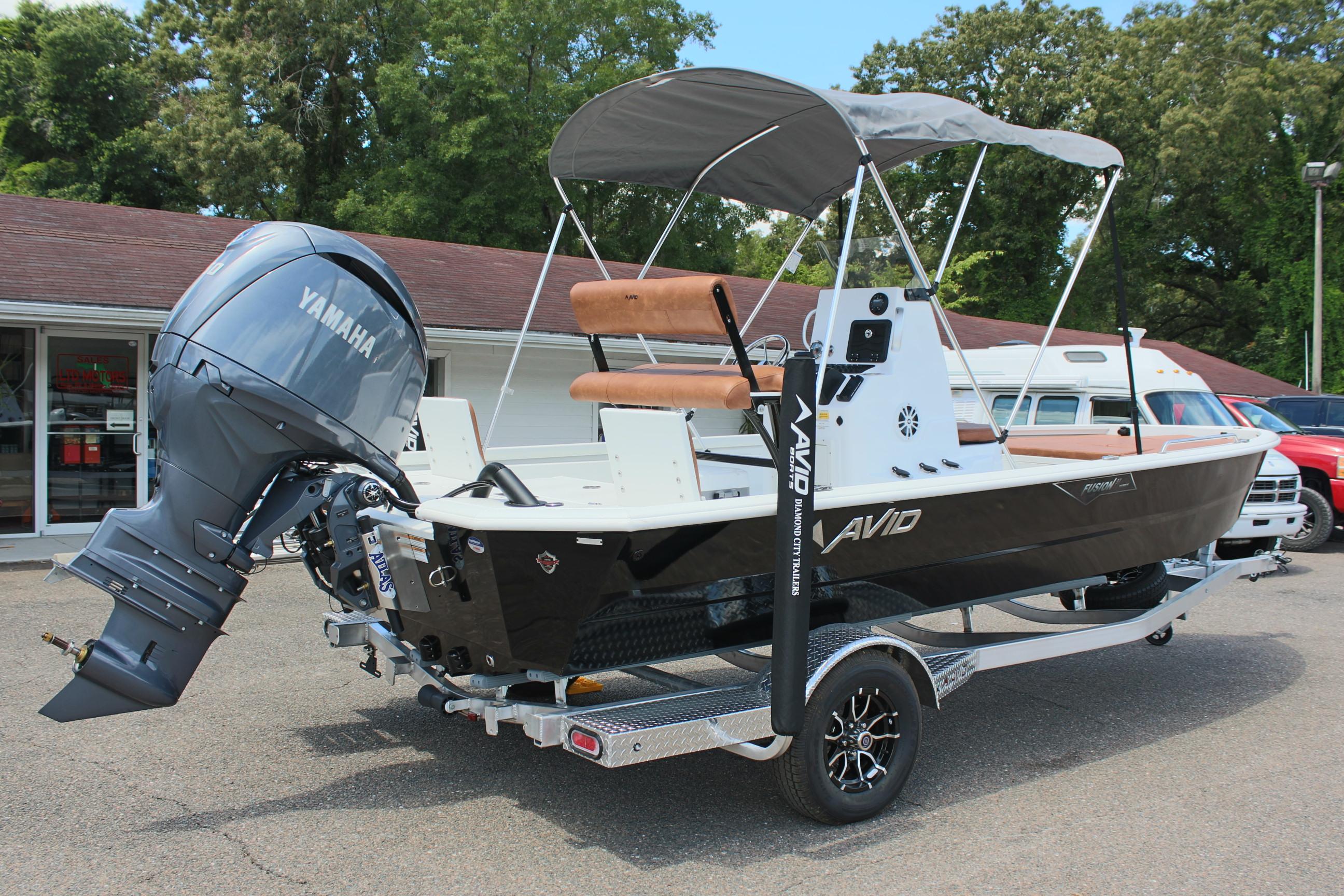 2024 Avid 21 Fusion boat with Yamaha outboard motor on a trailer.