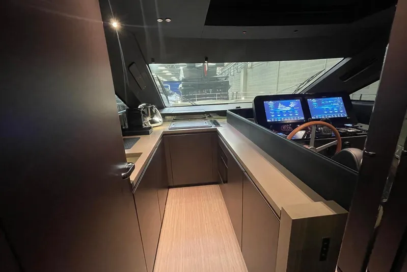  Yacht Photos Pics 2024 Cranchi 67 Sessantasette Fly yacht interior with modern helm and navigation screens.