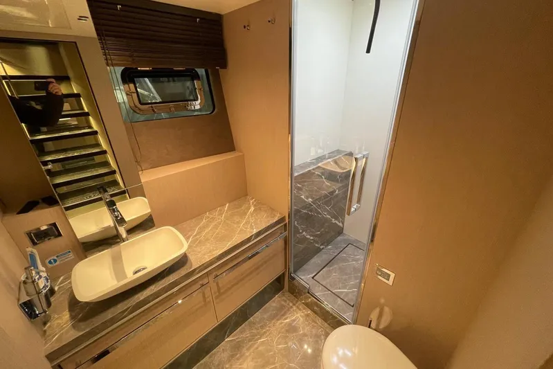 Yacht Photos Pics Luxurious bathroom in 2024 Cranchi 67 Sessantasette Fly yacht with marble finishes.