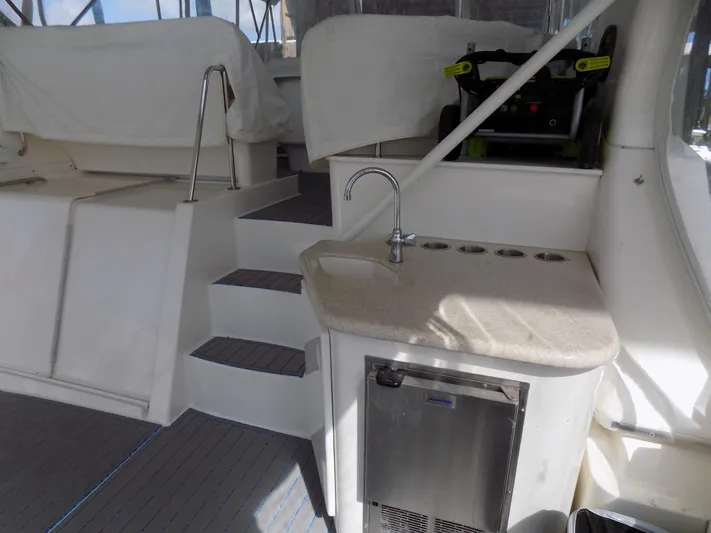  Yacht Photos Pics 2005 Silverton 43 Motor Yacht interior with kitchenette and stairs.