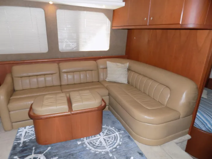  Yacht Photos Pics Luxurious interior of 2005 Silverton 43 Motor Yacht with leather seating and nautical decor.