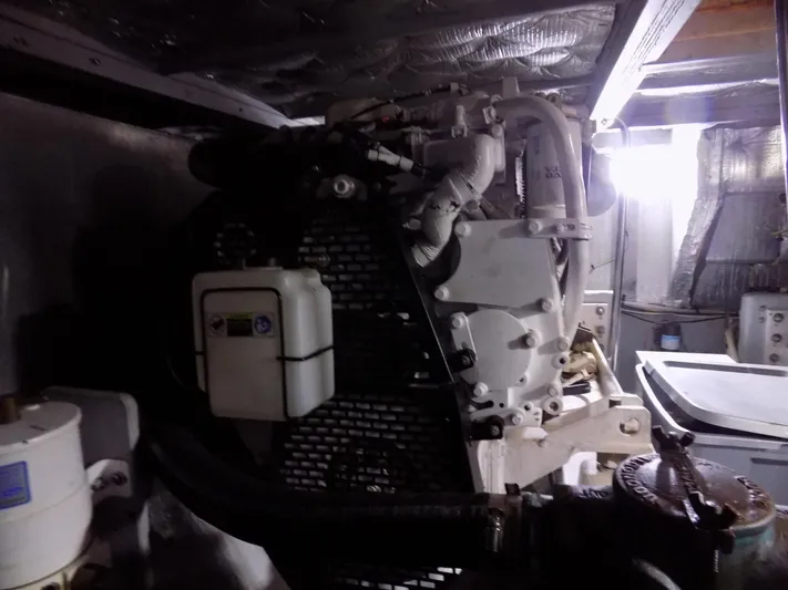  Yacht Photos Pics Engine room of a 2005 Silverton 43 Motor Yacht, showcasing mechanical components.