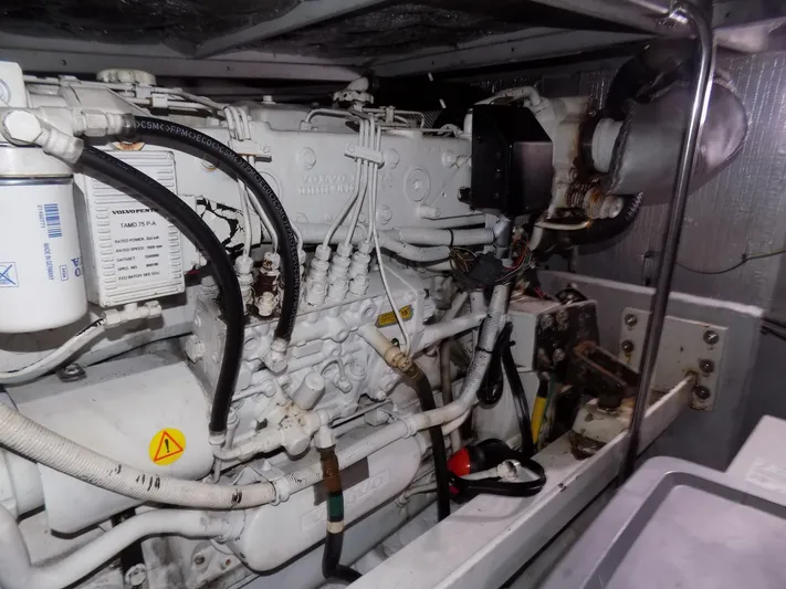  Yacht Photos Pics Engine room of a 2005 Silverton 43 Motor Yacht, showcasing mechanical components.