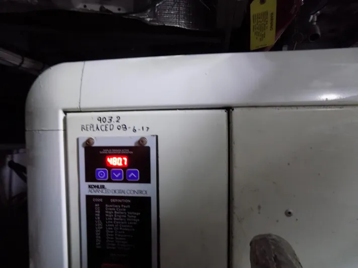  Yacht Photos Pics Control panel of a 2005 Silverton 43 Motor Yacht with digital display and handwritten notes.