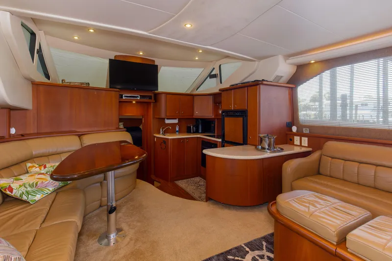  Yacht Photos Pics Luxurious interior of 2005 Silverton 43 Motor Yacht with elegant wood finishes and plush seating.