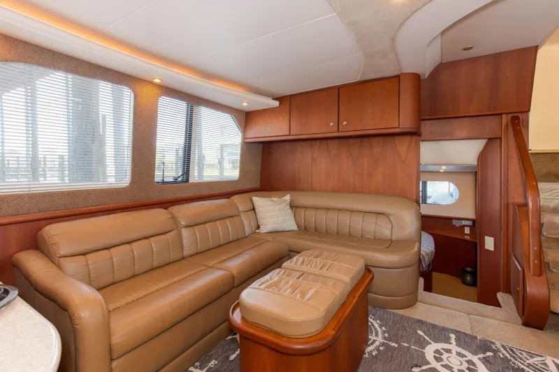  Yacht Photos Pics Luxurious interior of 2005 Silverton 43 Motor Yacht with leather seating and wood accents.