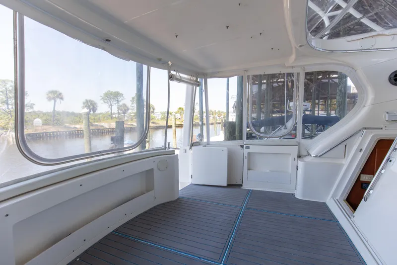  Yacht Photos Pics Spacious interior of 2005 Silverton 43 Motor Yacht with large windows and sleek design.