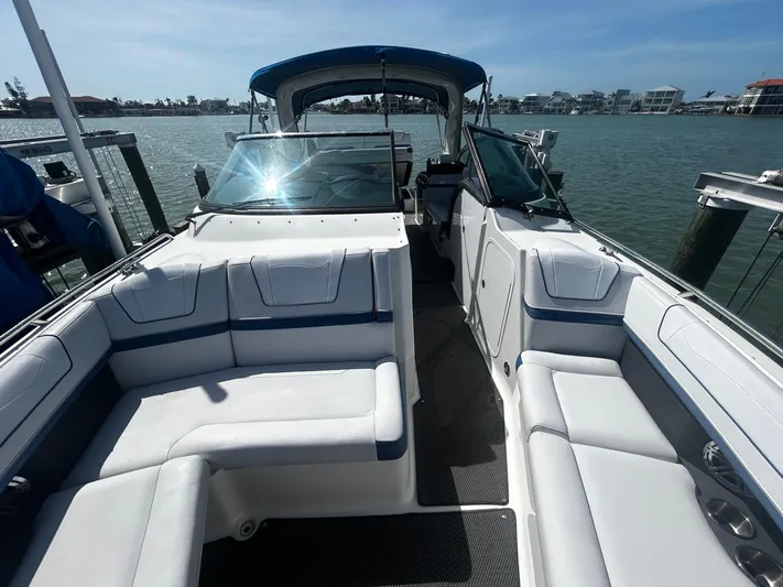 Yacht Photos Pics 2017 Formula 350 FX Crossover Bowrider with spacious seating, docked by the water.