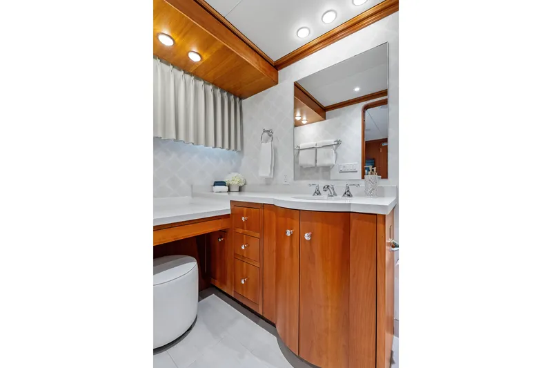 Silver Seas Yacht Photos Pics Luxurious bathroom in 1998 Burger Raised Pilothouse yacht with wooden cabinetry and modern fixtures.