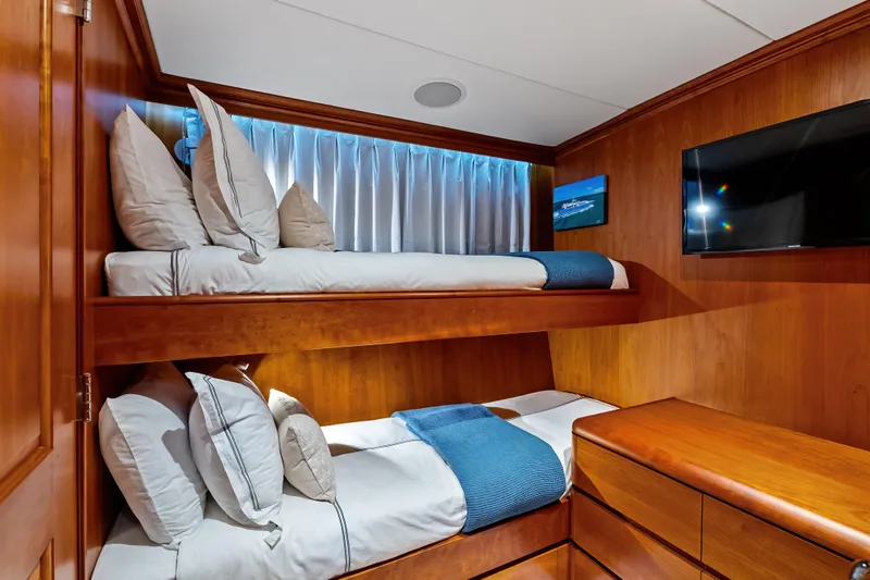 Silver Seas Yacht Photos Pics Luxurious 1998 Burger Raised Pilothouse yacht cabin with wooden bunk beds and modern amenities.