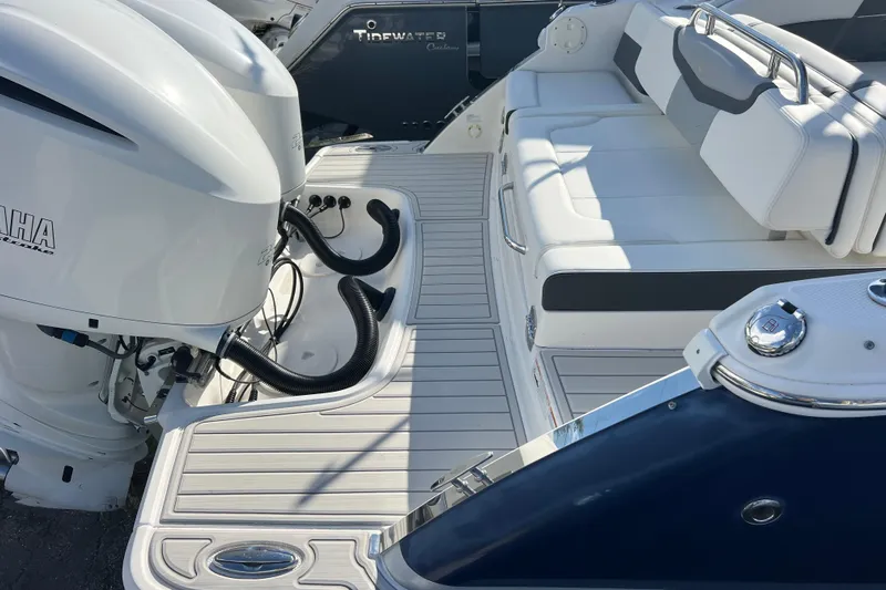 Yacht Photos Pics 2020 Chaparral 280 OSX boat with Yamaha outboard engines and white seating area.