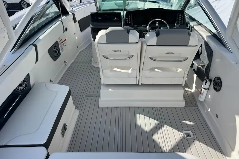  Yacht Photos Pics 2020 Chaparral 280 OSX boat interior with seating and steering console.