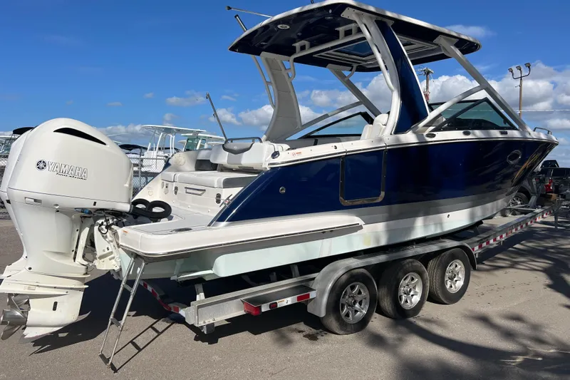  Yacht Photos Pics 2020 Chaparral 280 OSX boat on trailer with Yamaha outboard motor.