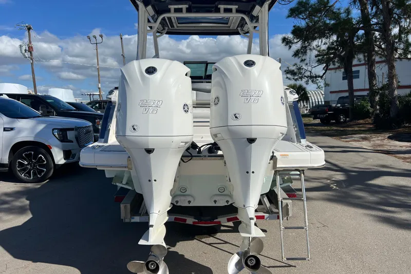  Yacht Photos Pics 2020 Chaparral 280 OSX boat with twin Yamaha 250 V6 engines, parked outdoors.