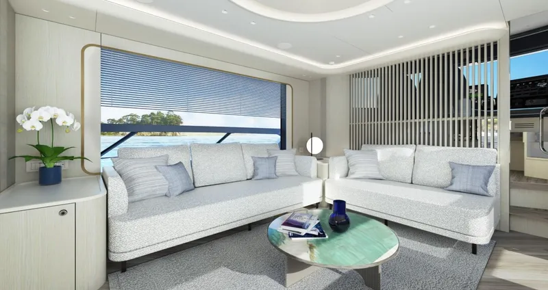 Absolute Navetta 70 Yacht Photos Pics Luxurious interior of 2025 Absolute NAVETTA 70 yacht with modern seating and ocean view.