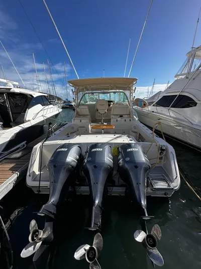  Yacht Photos Pics 2016 Grady-White Express 370 boat with triple outboard engines docked at marina.
