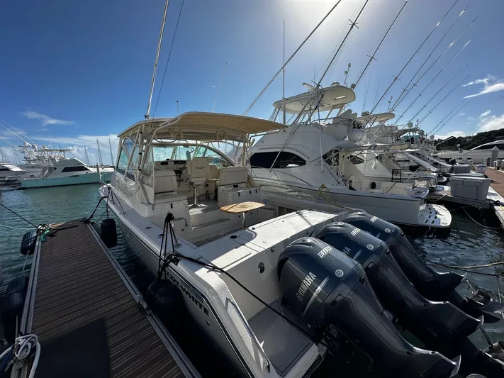  Yacht Photos Pics 2016 Grady-White Express 370 boat docked with triple Yamaha engines.