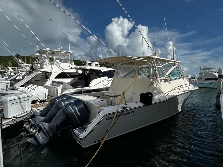  Yacht Photos Pics 2016 Grady-White Express 370 boat docked in marina, featuring twin Yamaha outboard engines.