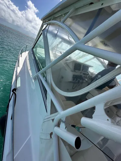  Yacht Photos Pics 2016 Grady-White Express 370 boat on clear blue water under a sunny sky.