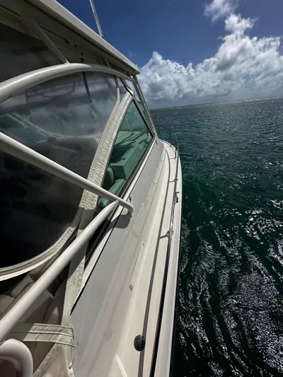  Yacht Photos Pics 2016 Grady-White Express 370 boat cruising on open sea under clear skies.