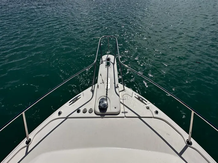  Yacht Photos Pics Bow view of 2016 Grady-White Express 370 boat on calm water.