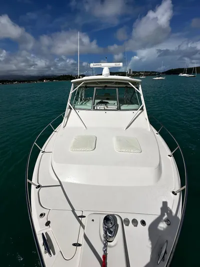  Yacht Photos Pics 2016 Grady-White Express 370 boat on calm blue water under a partly cloudy sky.