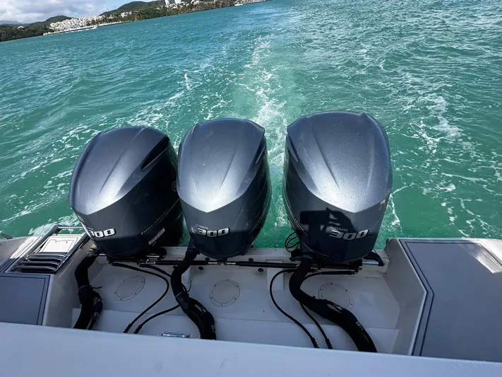  Yacht Photos Pics 2016 Grady-White Express 370 with triple 300 horsepower engines on turquoise water.