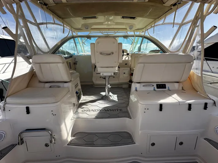  Yacht Photos Pics 2016 Grady-White Express 370 boat interior with white seating and helm station.