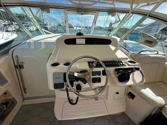  Yacht Photos Pics 2016 Grady-White Express 370 helm with steering wheel and controls, docked at marina.
