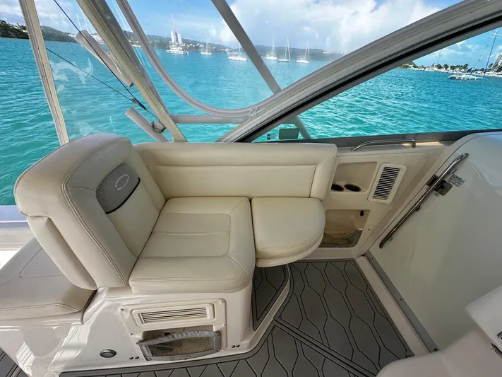  Yacht Photos Pics 2016 Grady-White Express 370 boat interior with beige seating, overlooking turquoise waters.