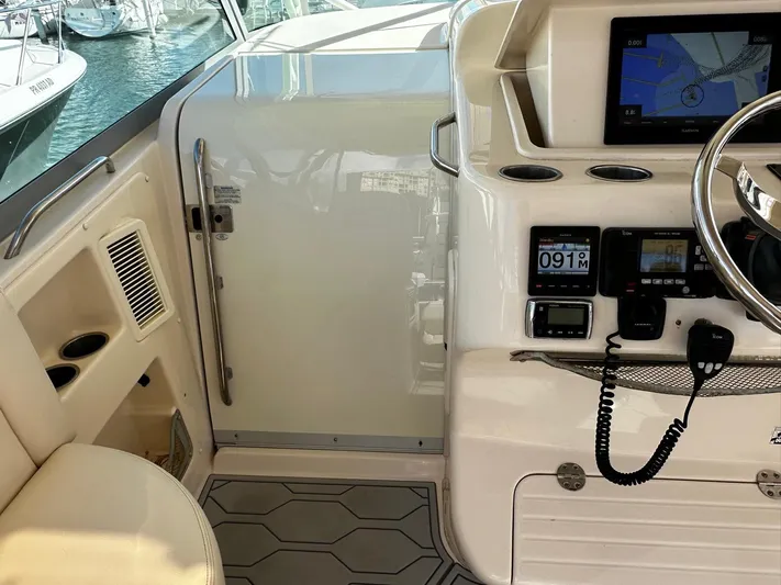  Yacht Photos Pics 2016 Grady-White Express 370 helm with navigation equipment and controls.