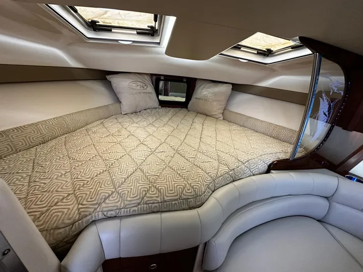  Yacht Photos Pics Luxurious cabin interior of 2016 Grady-White Express 370 with plush bedding and skylights.