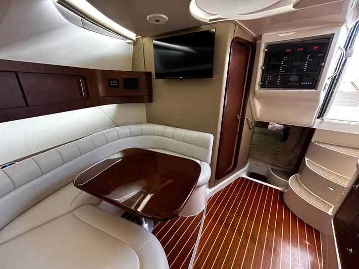  Yacht Photos Pics 2016 Grady-White Express 370 cabin interior with wood flooring and plush seating.
