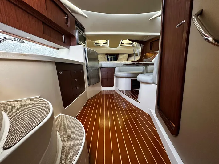  Yacht Photos Pics 2016 Grady-White Express 370 interior with wood flooring and modern seating.