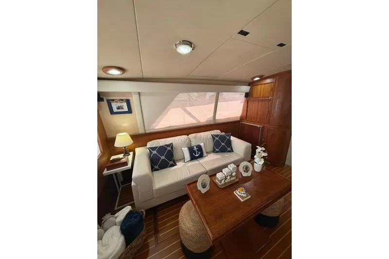  Yacht Photos Pics Interior of 1988 Bertram 43 Flybridge yacht with cozy seating and nautical decor.