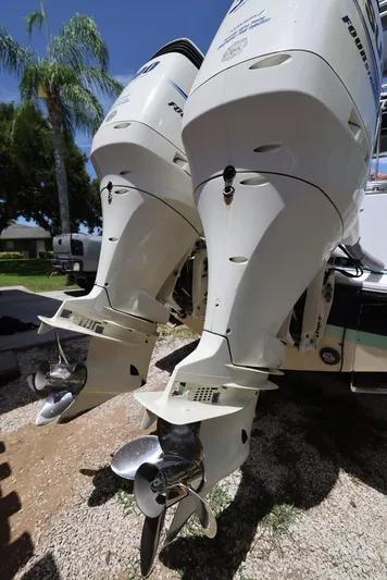 Late Fees Yacht Photos Pics Twin outboard motors on a 2001 Contender 27 Open boat.