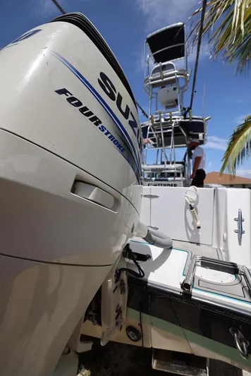 Late Fees Yacht Photos Pics 2001 Contender 27 Open boat with Suzuki Four Stroke engine.