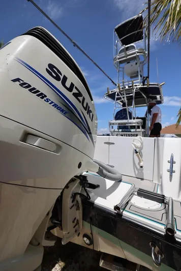 Late Fees Yacht Photos Pics 2001 Contender 27 Open boat with Suzuki Four Stroke engine.