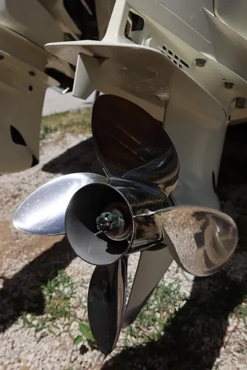 Late Fees Yacht Photos Pics Close-up of a 2001 Contender 27 Open boat propeller.