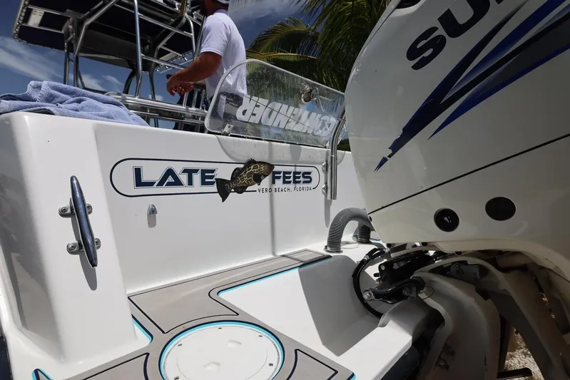 Late Fees Yacht Photos Pics 2001 Contender 27 Open boat with Suzuki engine, Late Fees nameplate.