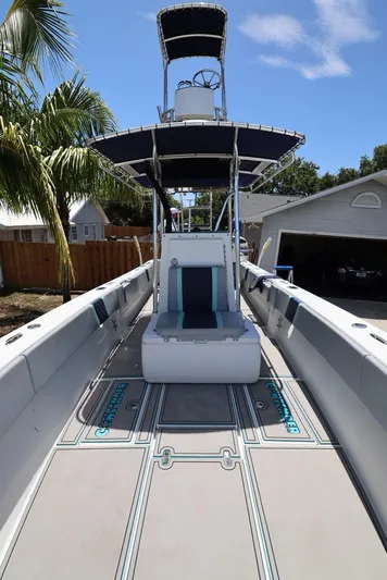 Late Fees Yacht Photos Pics 2001 Contender 27 Open boat with T-top and spacious deck.