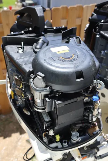 Late Fees Yacht Photos Pics 2001 Contender 27 Open boat engine close-up.