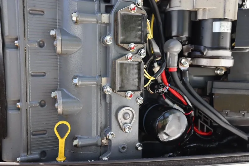 Late Fees Yacht Photos Pics Close-up of a 2001 Contender 27 Open boat engine components.