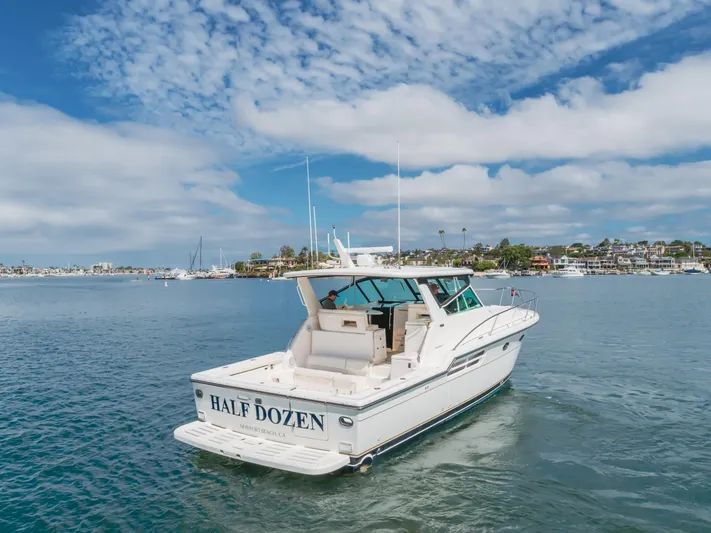 Half Dozen Yacht Photos Pics 2001 Tiara Yachts 4100 Open cruising in scenic coastal waters.