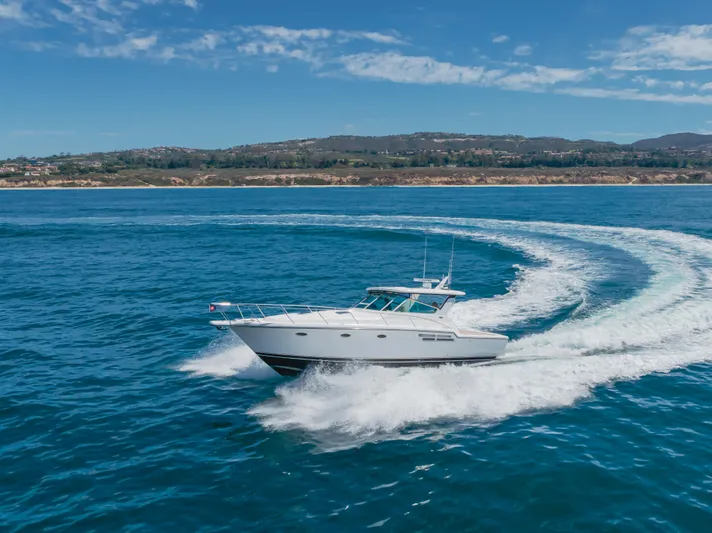 Half Dozen Yacht Photos Pics 2001 Tiara Yachts 4100 Open cruising on blue ocean waters.