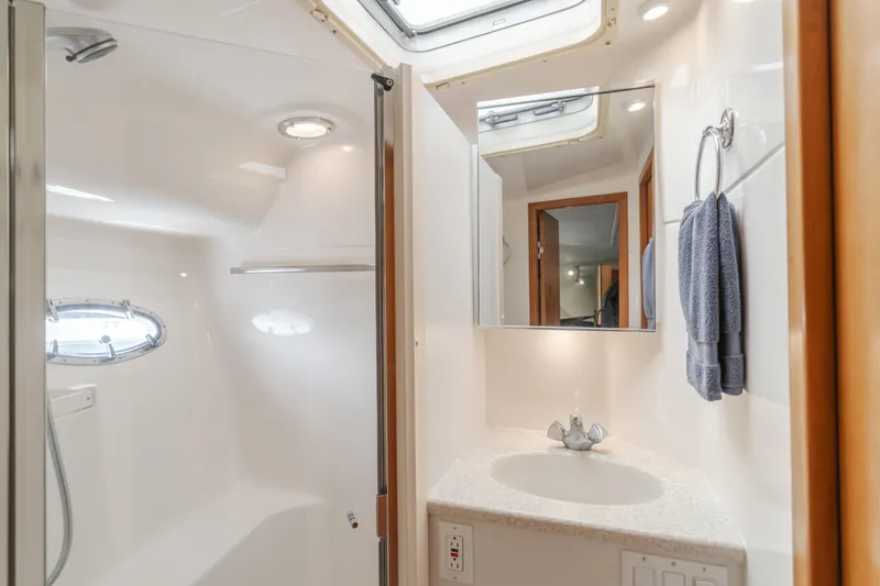 Half Dozen Yacht Photos Pics Luxurious bathroom in 2001 Tiara Yachts 4100 Open, featuring modern fixtures and elegant design.