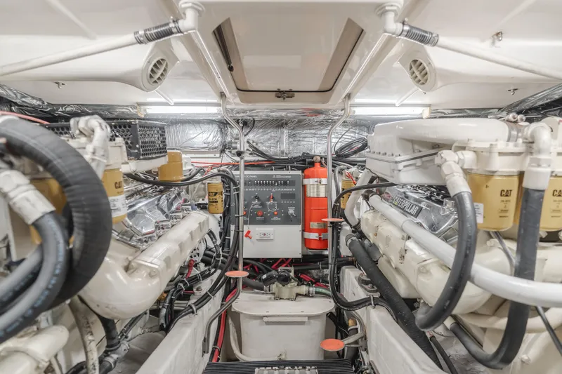 Half Dozen Yacht Photos Pics Engine room of 2001 Tiara Yachts 4100 Open, featuring Caterpillar engines and control panel.