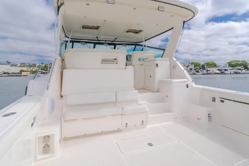 Half Dozen Yacht Photos Pics 2001 Tiara Yachts 4100 Open boat interior with white seating and open deck.