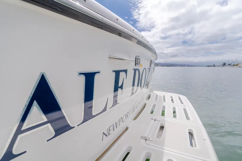 Half Dozen Yacht Photos Pics 2001 Tiara Yachts 4100 Open, docked with visible name and serene water backdrop.