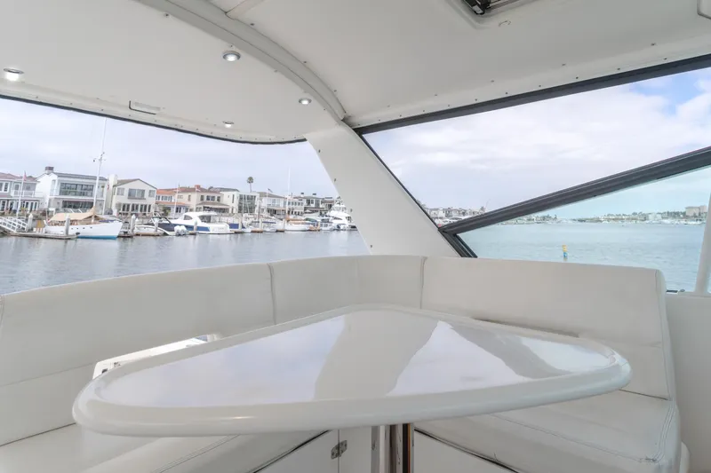 Half Dozen Yacht Photos Pics Interior view of 2001 Tiara Yachts 4100 Open, featuring a sleek white seating area.